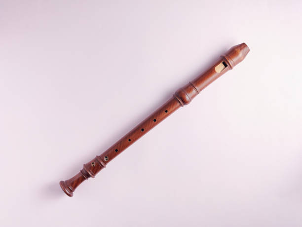 istock Wooden baroque recorder isolated on light background 1351853570