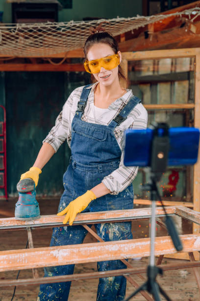 istock Young woman making video blog in the workshop 1351858272