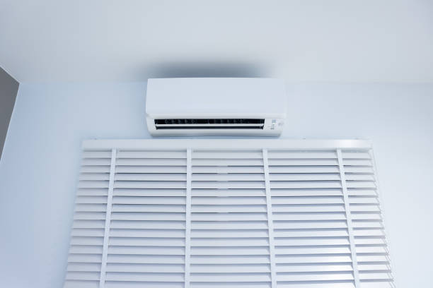 istock Air conditioner and adjusting vertical or venetian blinds. 1351861733