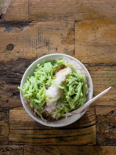 Cendol in a bowl. Green rice flour jelly iced dessert