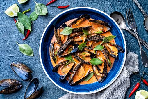 Delicious blue mussels in a spicy thai red curry sauce.