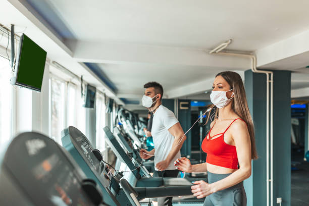 istock Young people wearing face mask in the gym 1351862943