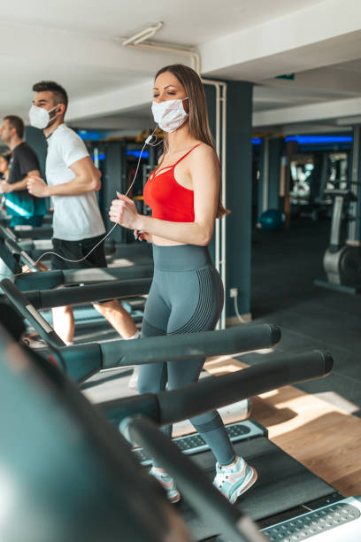 istock Young people wearing face mask in the gym 1351862959