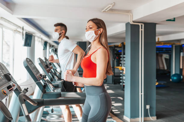 istock Young people wearing face mask in the gym 1351862971