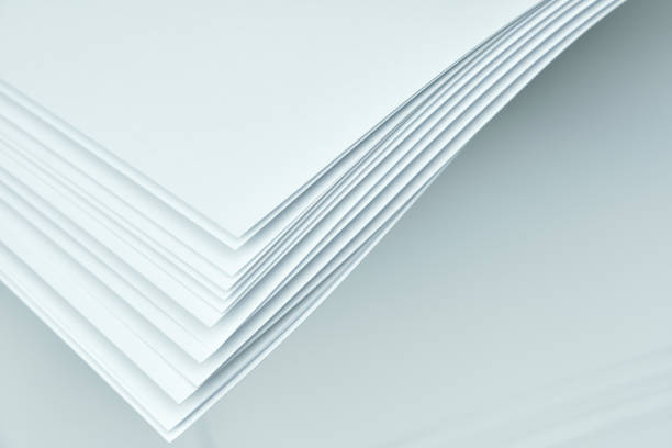 istock Corners of sheets of white paper on a white background. Abstract background. 1351866084