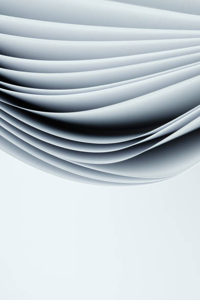 istock Several curved sheets of paper on a white background 1351866094