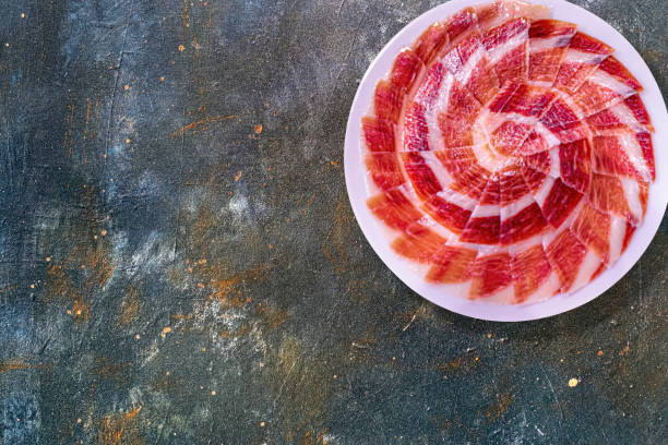 plato de jamón serrano con fondo galáctico - península ibérica fotografías e imágenes de stock