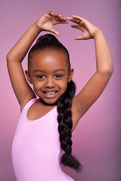 linda little african american girl dancing - ballet dress studio shot costume fotografías e imágenes de stock