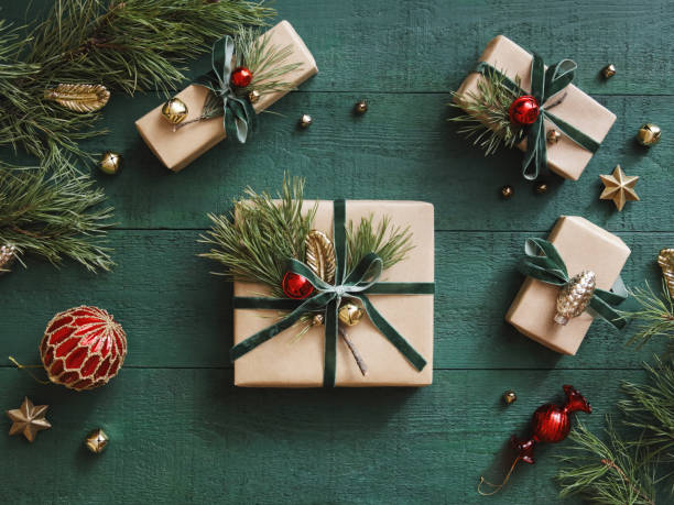 High angle view of Christmas present High angle view of Christmas present wrapped in kraft paper christmas present stock pictures, royalty-free photos & images