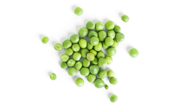 istock Green peas isolated on a white background 1351874262