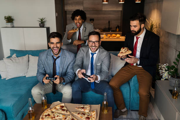 istock A group of young business man playing video games after work 1351874269