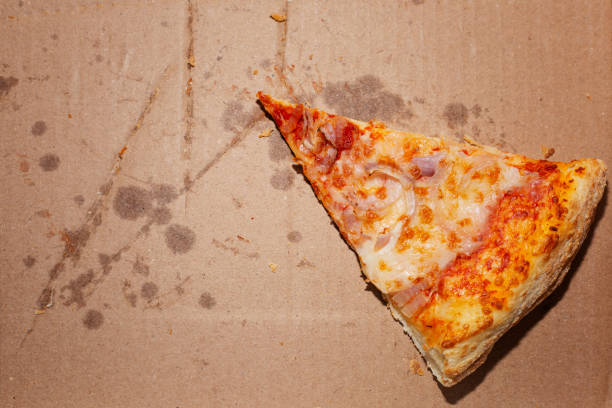 istock Leftovers of pizza in an empty takeaway box 1351874510