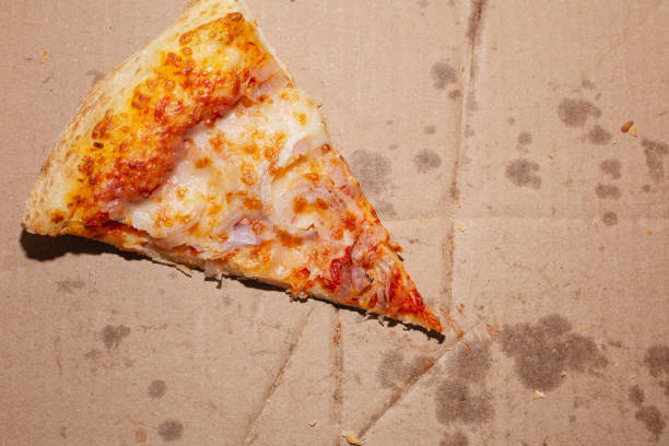 istock Leftovers of pizza in an empty takeaway box 1351874517