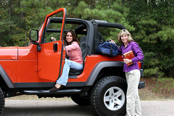 istock Young adults ready to leave in jeep 135187475