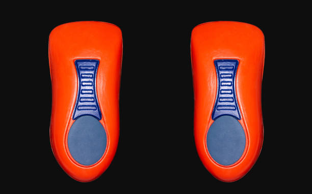 istock Orthopedic insole on a black background. 1351877104