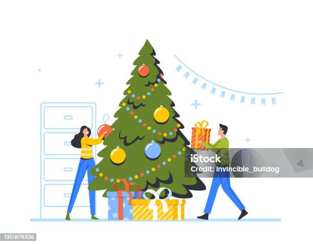 Christmas Tree Branches Holding Two Decorative Balls Stock Photo - Download  Image Now - iStock