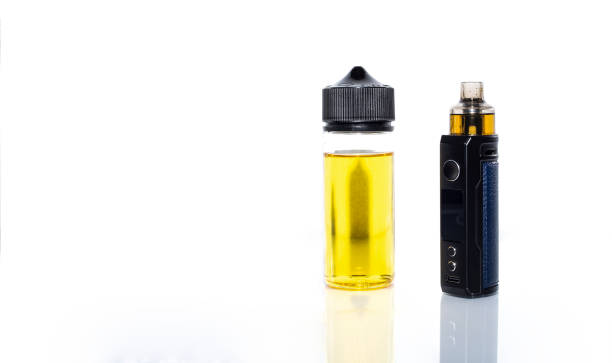 istock Electronic cigarette and vape liquid isolated on white background. 1351880180