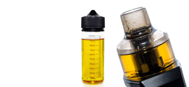 istock Electronic cigarette and vape liquid isolated on white background 1351880220