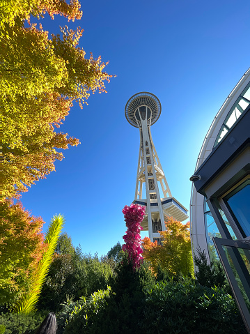 Seattle, WA - USA - Sept. 24, 2021: Vertical view of the Chihuly Garden and Glass, with the iconic Seattle Space Needle in the distance.