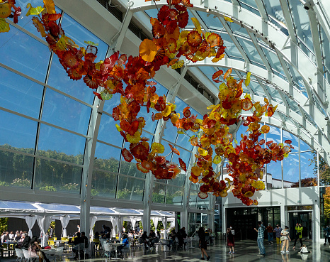 Seattle, WA - USA - Sept. 24, 2021: Landscape view of the Glasshouse of Chihuly Garden and Glass, a 40-foot tall, glass and steel structure covering 4,500 square feet of light-filled space.
