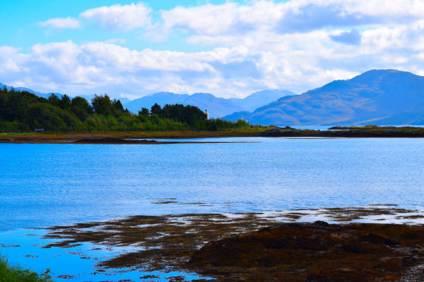 istock Mountain range over a bay in Scotland 1351884257