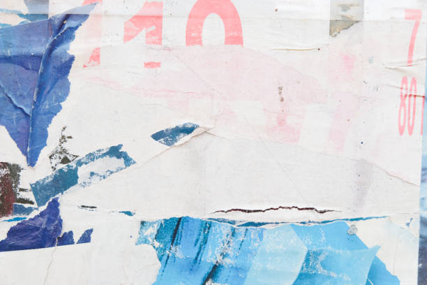 istock Torn street poster background. Abstract weathered paper texture. 1351884386