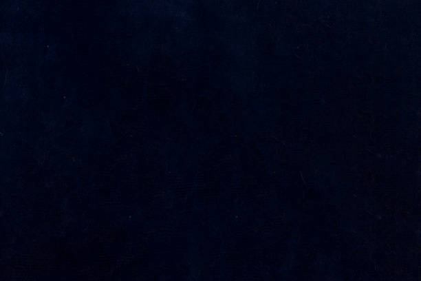 istock Dark non-uniform paper with spots and inclusions. 1351888434