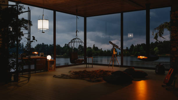 コージー レイク ハウス リビングルーム ウィズ レイクビュー イン イブニング - scandinavian lake cottage house ストックフォトと画像