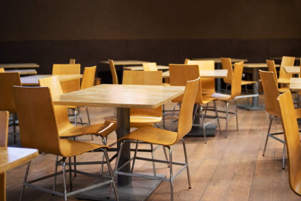 istock Many wooden tables and chairs in cafe 1351889430