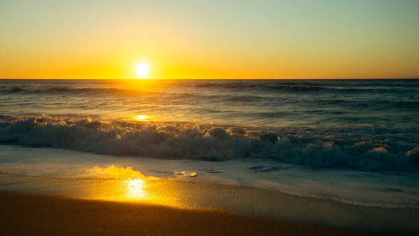 istock A warm sunset on the Atlantic coast with the surf. 1351891071