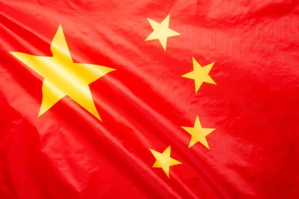 istock China flag waving as a background. 1351891317