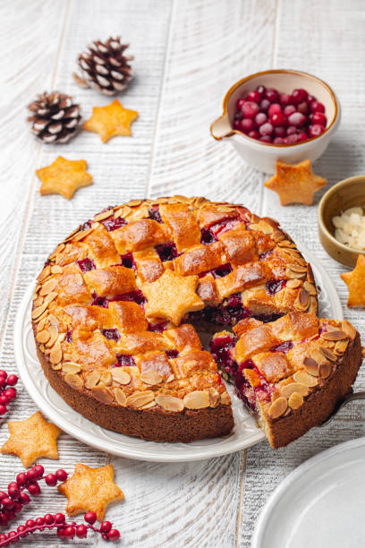 istock Christmas Linzer torte. Traditional Austrian cake with cranberries jam and almonds, lattice design on top. Homemade. Vertical image. 1351893520