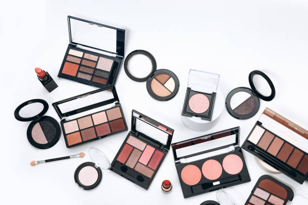 istock Makeup palettes with shadows and concealers. Make up products on white background 1351894048