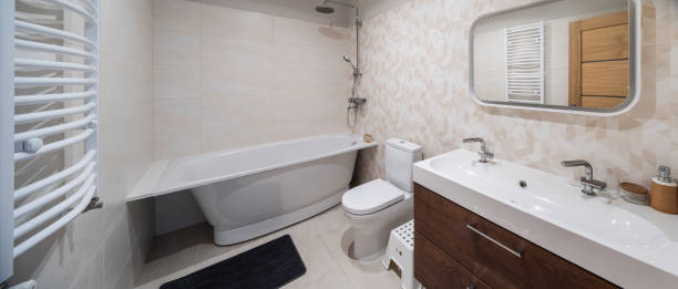 istock Modern interior of bathroom. White sink, toilet, bath. Tile floor. 1351895506