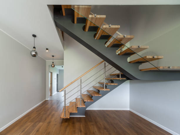 istock Modern interior of empty apartment. Wooden stairs. 1351895540