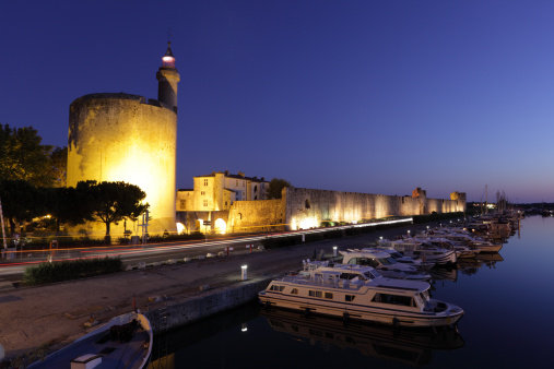 Ramparts of Aigues-Mortes illuminated at dusk. Languedoc-Roussillon, France