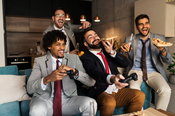 istock A group of young business man playing video games after work 1351901534
