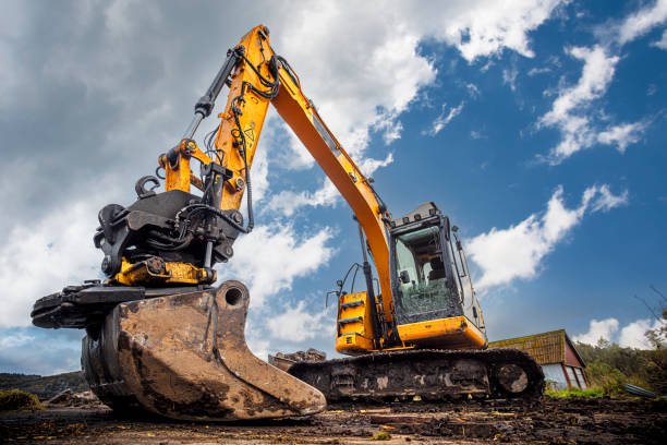 Excavator Yellow excavator in working site excavated material stock pictures, royalty-free photos & images