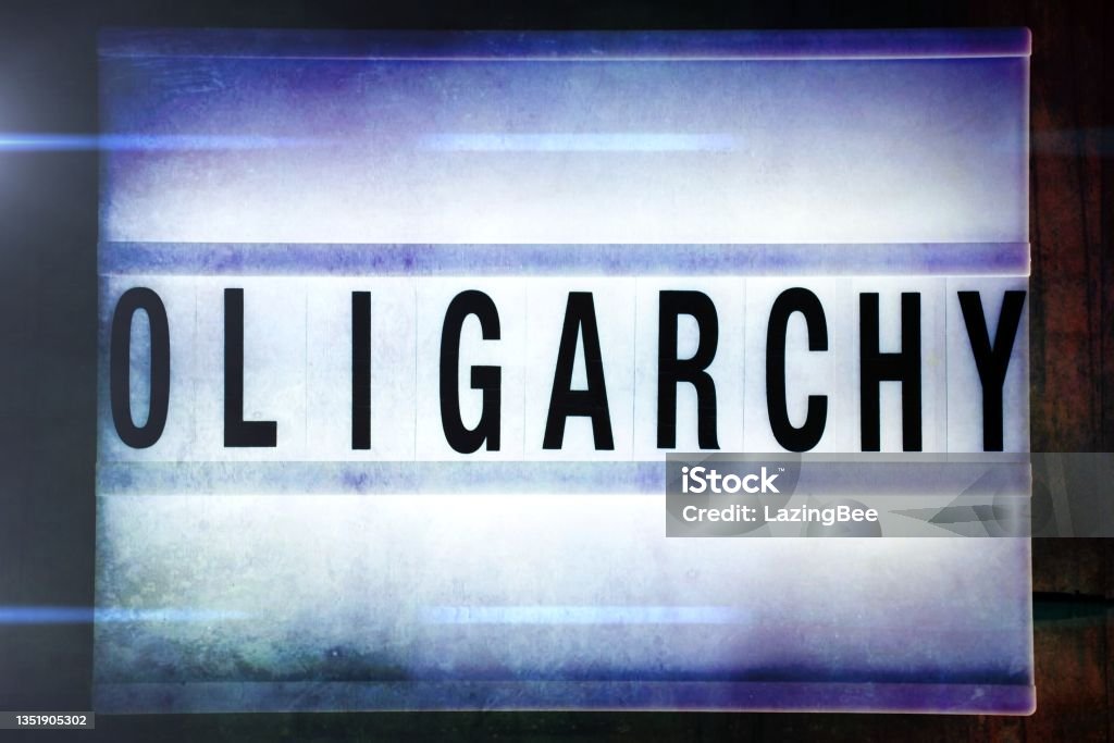 Oligarchy in Lightbox Trend Words 'Oligarchy' in a Light Box Trend for a Rise of the Oligarch Theme. This is part of my Signs for 2021 for Social History. Activist Stock Photo