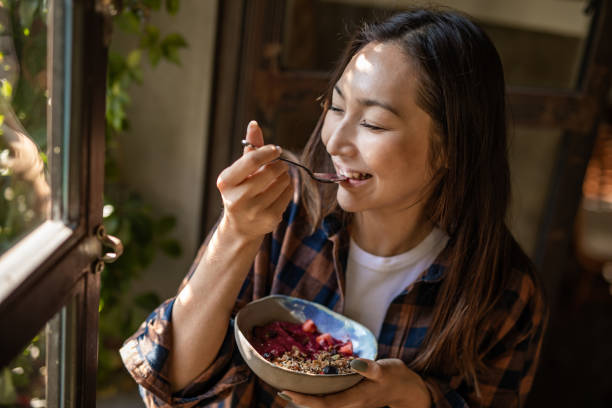 istock A modern Asian woman eats a fruit saladat a restaurant in Isnatbul 1351906957