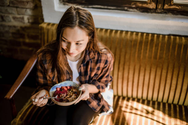 istock A modern Asian woman eats a fruit saladat a restaurant in Isnatbul 1351906980