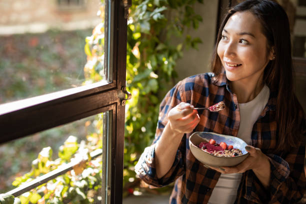 istock A modern Asian woman eats a fruit saladat a restaurant in Isnatbul 1351906989
