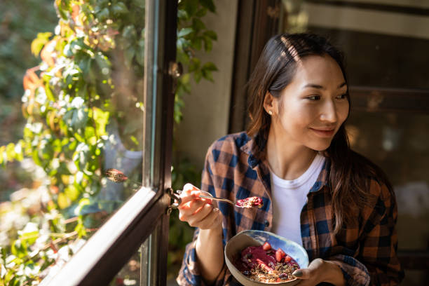 istock A modern Asian woman eats a fruit saladat a restaurant in Isnatbul 1351907002