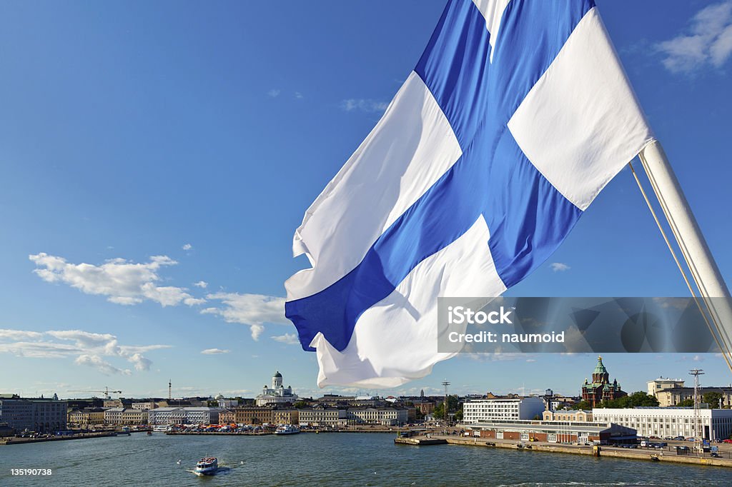 Waving Finnish Flag Flag of Finland against Helsinki panorama Finland Stock Photo