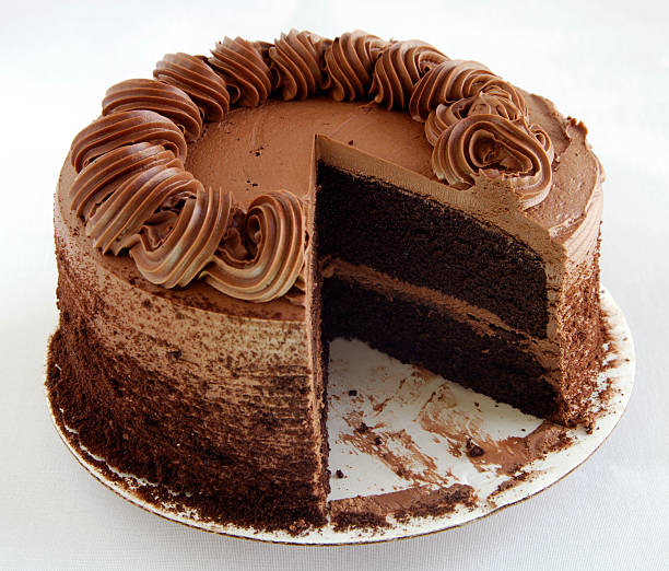 Two layer chocolate cake with chocolate icing stock photo