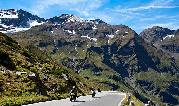 istock A procession of motorbikes riding up a paved mountain road 135191329
