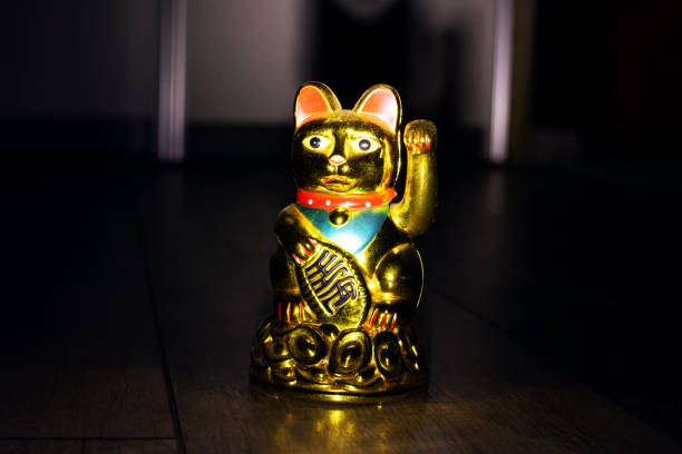 istock Japanese cat maneki neko in the dark 1351913737