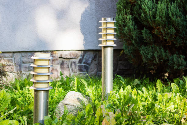 Two small street lamps on lawn in garden Two small street lamps on the lawn in the garden landscape lighting stock pictures, royalty-free photos & images