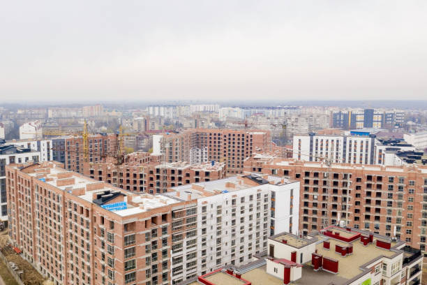 istock High-rise multi-storey buildings under construction. Tower cranes near building. Activity, architecture, development process. 1351914888
