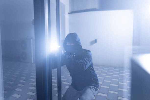 Safe break-in, dark colors. Lock opening. Security, home protection, risk minimizing concepts. Safety of savings and oney protection idea.